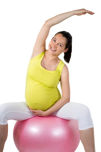 Beautiful pregnant woman doing some physical exercises — Stock Photo, Image