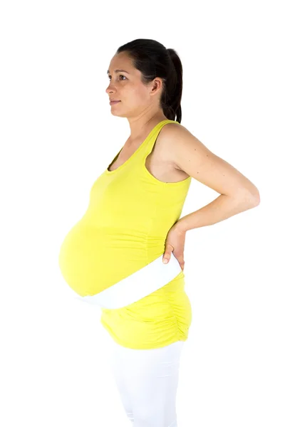 Pregnant woman use back support belt — Stock Photo, Image
