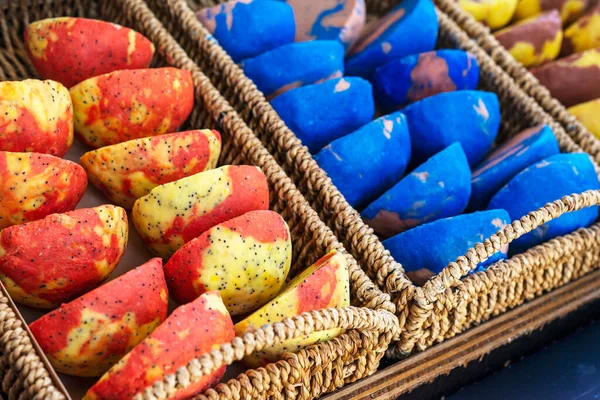 Colourful handmade soaps in baskets at the street market stall. Selective focus.