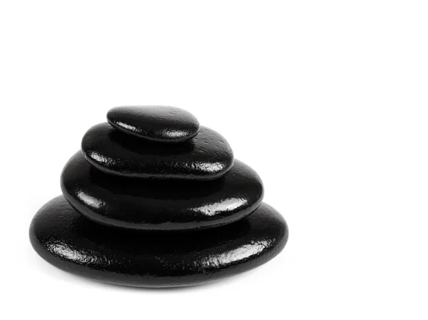 Черные камни на белом фоне — стоковое фото