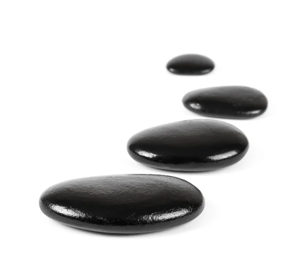 Pedras pretas sobre fundo branco — Fotografia de Stock