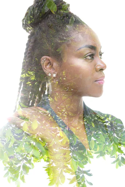 A double exposure portrait of a woman combined with an image of twigs. — Stock Photo, Image