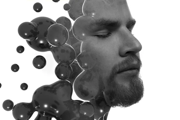Un portrait double exposition d'un beau jeune homme combiné avec des sphères flottantes. — Photo