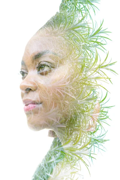 A double exposure portrait of a woman combined with an image of twigs. We are one with nature. — Stock Photo, Image