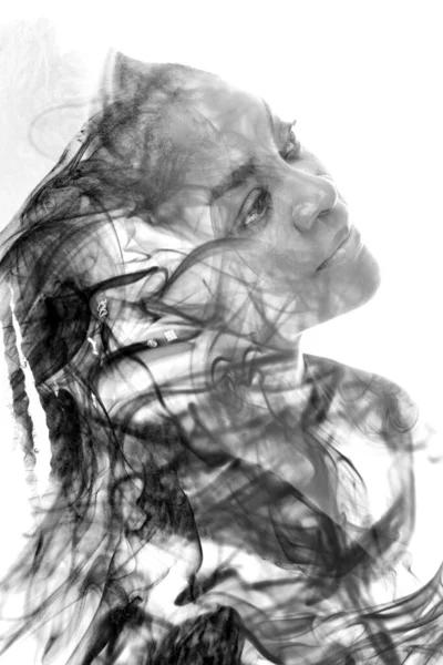 A portrait of a woman combined with an image of smoke in a double exposure technique. — Stock Photo, Image