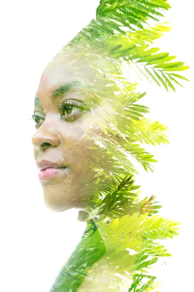 A double exposure portrait of a woman combined with an image of a plant. Dreaming about nature. — Stock Photo, Image