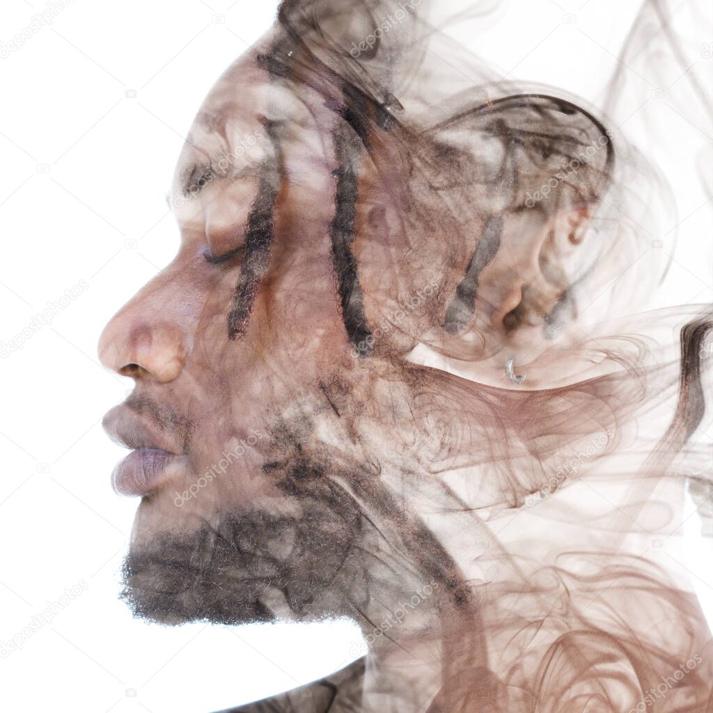 A portrait of a man dissolving into smoke. Double exposure.