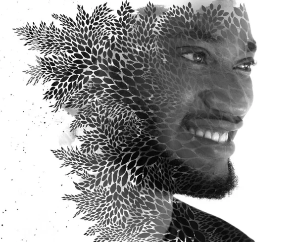Een portret van een man gecombineerd met een schilderij van bladeren. Paintografie. — Stockfoto