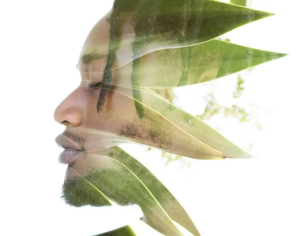 Een portret van een man gecombineerd met wilde natuur in een dubbele belichtingstechniek. — Stockfoto