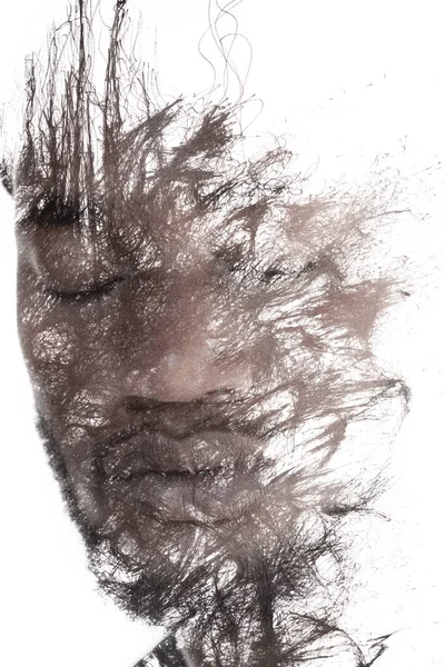 Un ritratto di un giovane uomo combinato con linee di inchiostro nero. Pittografia. — Foto Stock