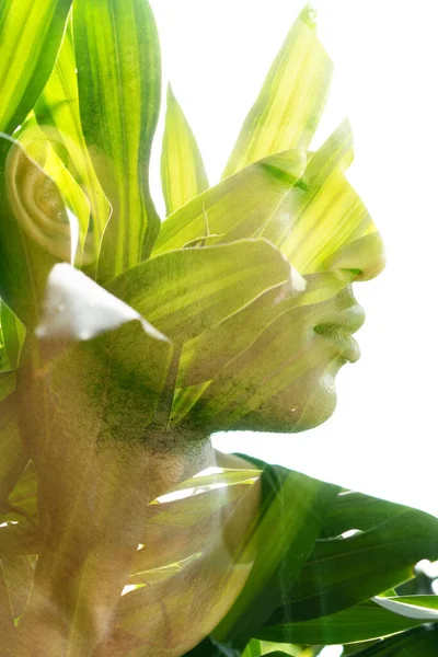 A portrait of a young African American man combined with a tropical plant — Stok fotoğraf