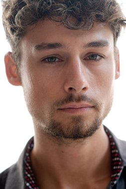 A portrait of young guy against a white background