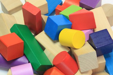 Stack of colorful wooden building blocks clipart