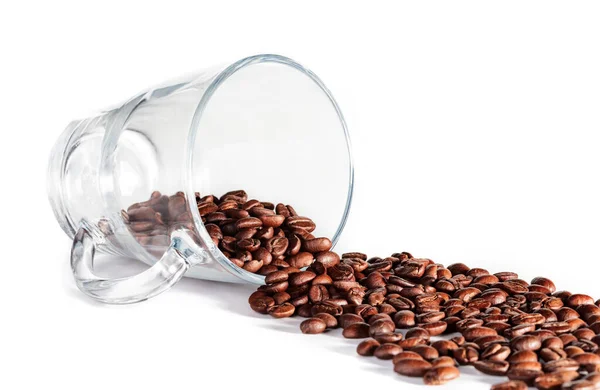 Glas cup met koffie bonen — Stockfoto