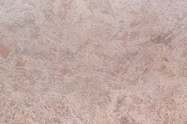 Dokulu arka plan. Dekoratif alçı duvarlar, dış cephe dekorasyonu. Bej rengi, pembe.