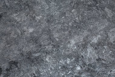 Koyu arkaplan. Dekoratif alçı duvarlar, duvar kağıtları. Siyah desenli dekoratif duvarlar.