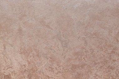 Dokulu arka plan. Dekoratif alçı duvarlar, dış cephe dekorasyonu. Bej rengi, pembe.