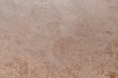 Dokulu arka plan. Dekoratif alçı duvarlar, dış cephe dekorasyonu. Bej rengi, pembe.