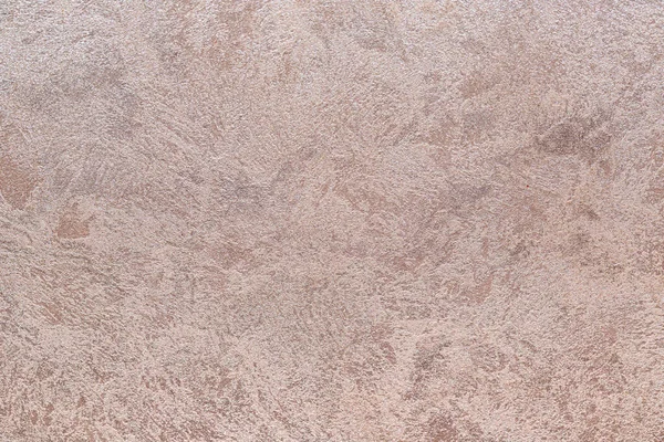 Dokulu arka plan. Dekoratif alçı duvarlar, dış cephe dekorasyonu. Bej rengi, pembe.