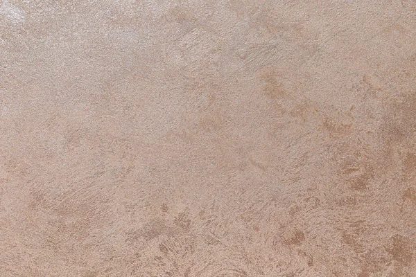 Dokulu arka plan. Dekoratif alçı duvarlar, dış cephe dekorasyonu. Bej rengi, pembe.