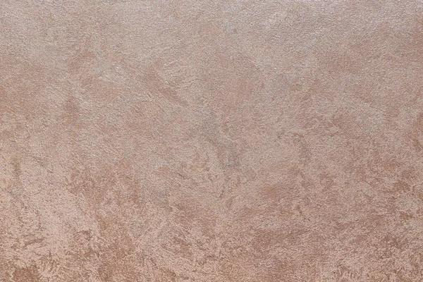 Dokulu arka plan. Dekoratif alçı duvarlar, dış cephe dekorasyonu. Bej rengi, pembe.