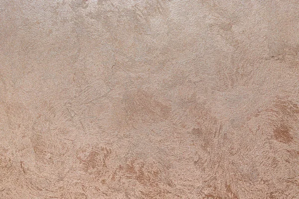 Dokulu arka plan. Dekoratif alçı duvarlar, dış cephe dekorasyonu. Bej rengi, pembe.