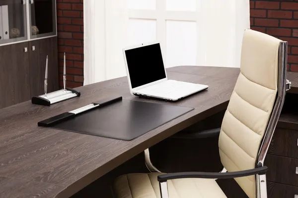 Laptop on a desk — Stock Photo, Image