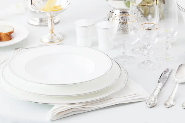 plates, glasses and silverware