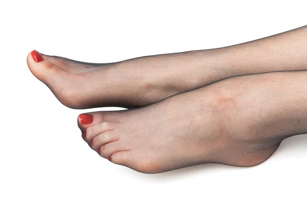 Piedi femminili in calze — Foto Stock