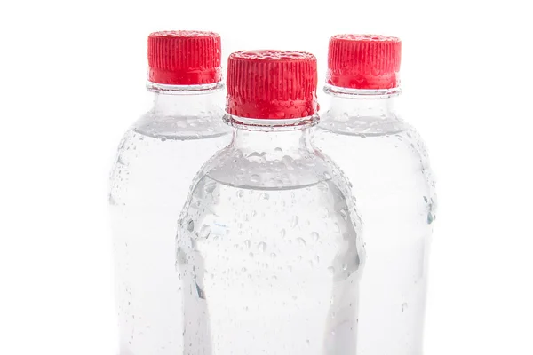 Botellas de plástico de agua potable aisladas —  Fotos de Stock