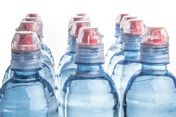 Garrafa de plástico de água potável isolada em branco — Fotografia de Stock