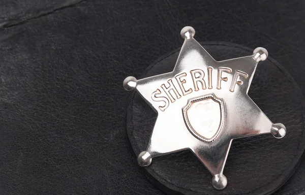 Sheriff's badge on dark background — Stock Photo, Image