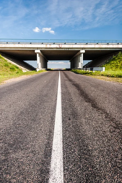 Bridge over the rural road — Stock Photo, Image