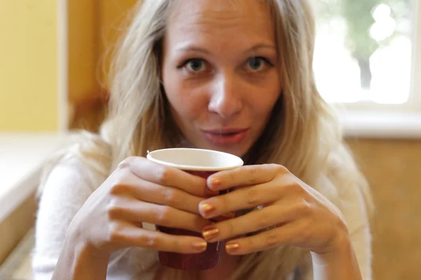 The young beautiful girl with a cup — Stock Photo, Image