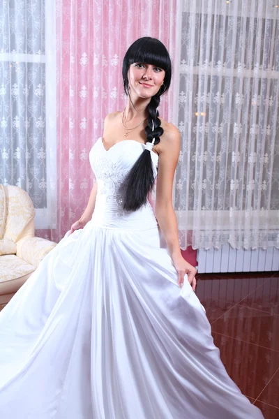 Beauty young bride dressed in... — Stock Photo, Image