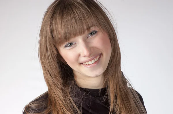 Attractive young woman with long blond hair — Stock Photo, Image