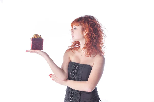 Pretty red haired girl with giftbox — Stock Photo, Image