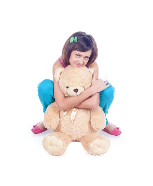 Teenager girl holding toy bear. — Stock Photo, Image