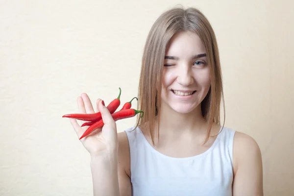 Beautiful girl with red pepper — Stock Photo, Image