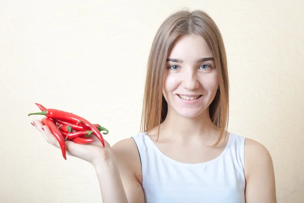 Beautiful girl with red pepper — Stock Photo, Image