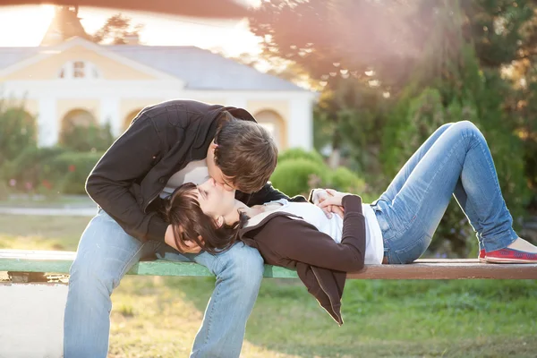 Happy smiling couple against sun lite — Stock Photo, Image