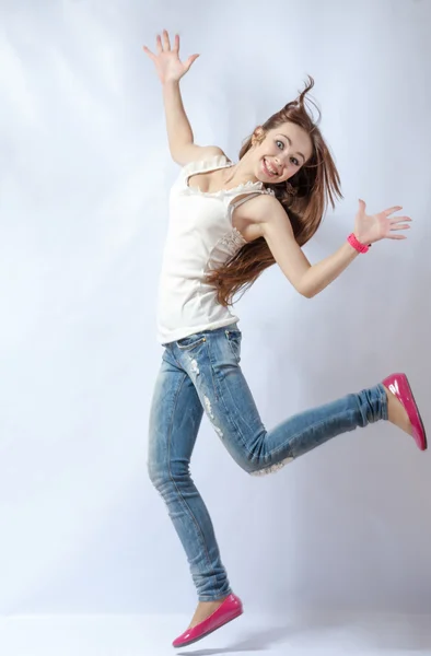 Young female dancing on white — Stock Photo, Image