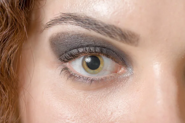 Macro shot of woman's eye with long eyelashes sensual look — Stock Photo, Image