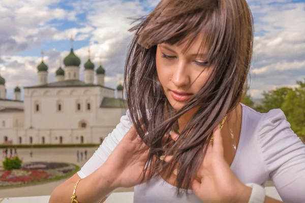 Girl with long hair in town — Stock Photo, Image