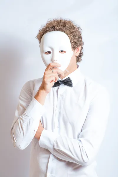 Face mime close-up emotion in thought, a black bow tie, and mask — Stock Photo, Image