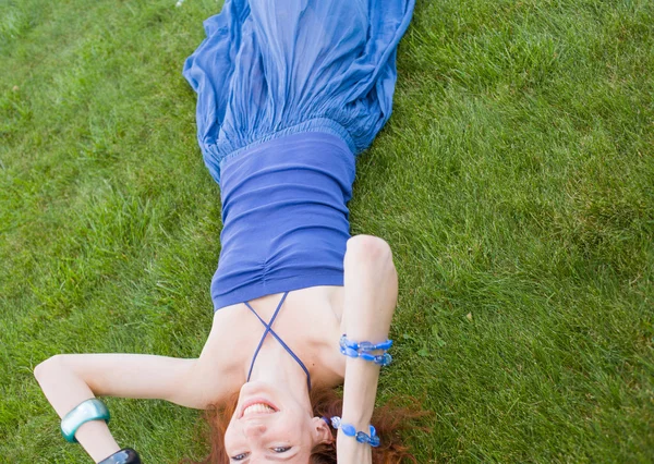 Redhead in fresh grass summertime fun — Stock Photo, Image