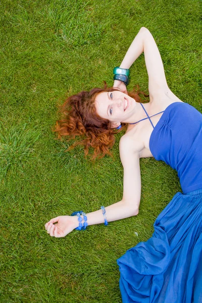 Redhead in fresh grass summertime fun — Stock Photo, Image