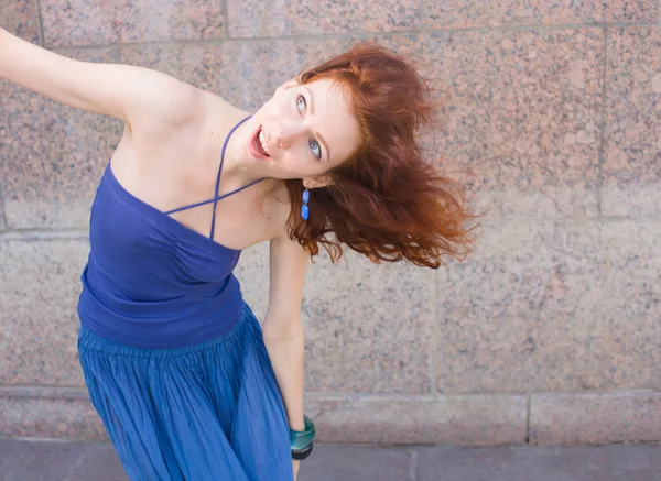 Redhead dancing outdoors — Stock Photo, Image