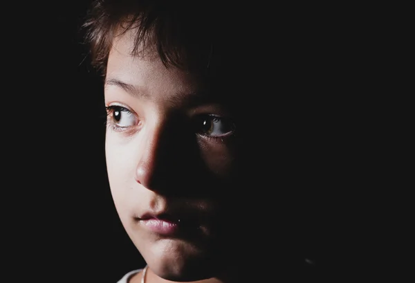 Sad boy in the dark, headshot — Stock Photo, Image