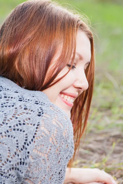 Red haired women lying on autumn grass — Stock Photo, Image